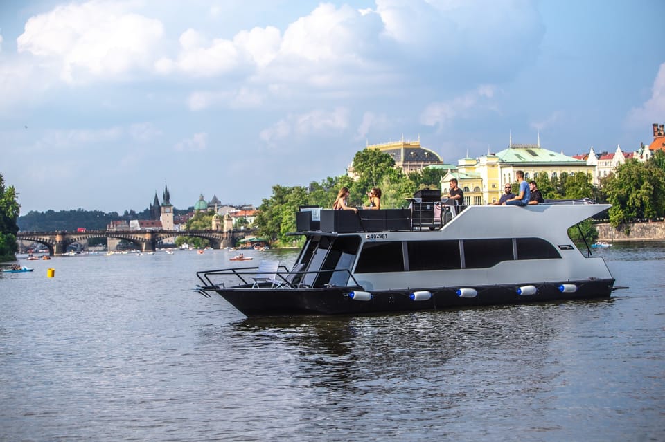 Prague: Private River Cruise with Unlimited Beer or Prosecco - Landmark views you’ll catch: Prague Castle, Charles Bridge, and Dancing House